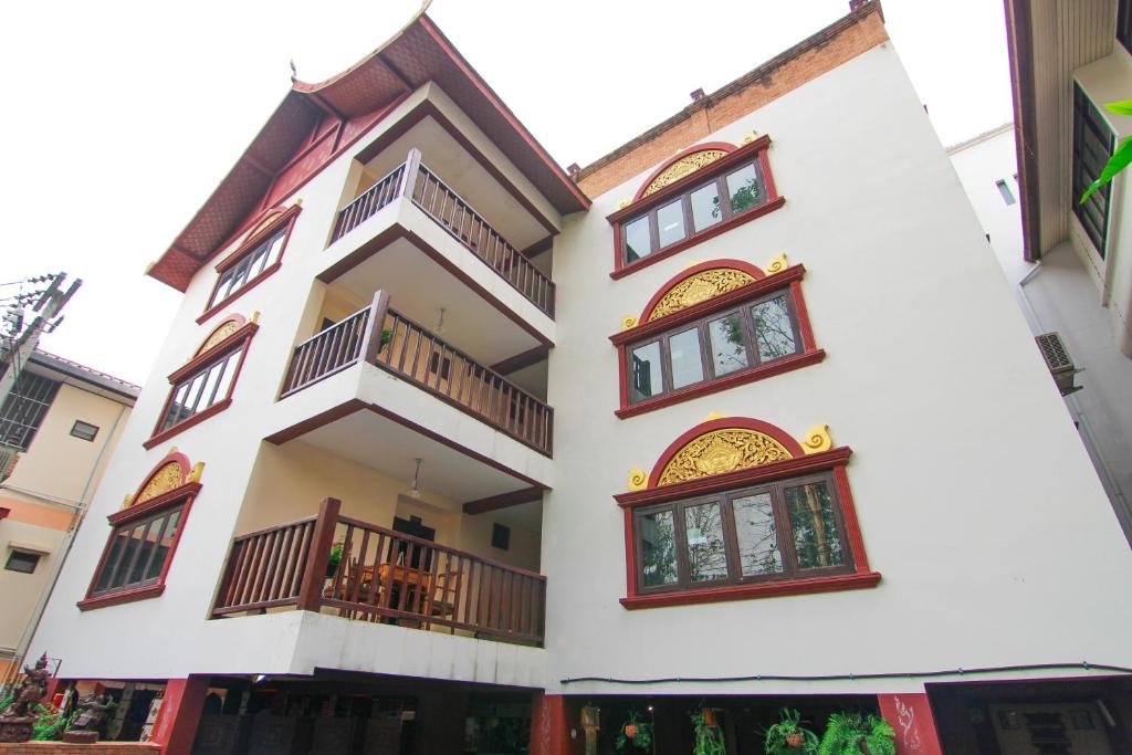 a large building with a balcony and windows at S.K.House 2 in Chiang Mai