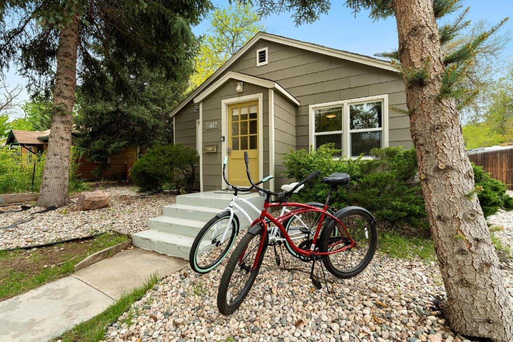 a red bike parked in front of a house at Charming Old Town Bungalow with Free Cruiser Bikes in Fort Collins