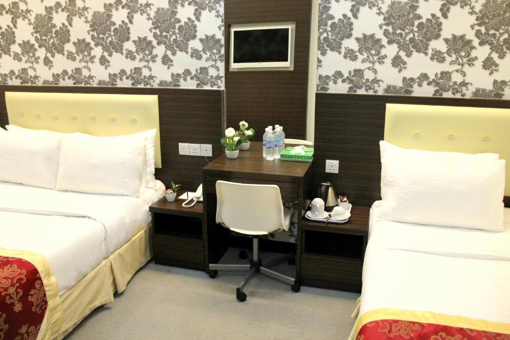 Postel nebo postele na pokoji v ubytování Springz Hotel-Bukit Jalil