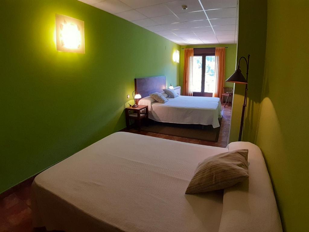 Postel nebo postele na pokoji v ubytování Hotel Rural Los Molinillos