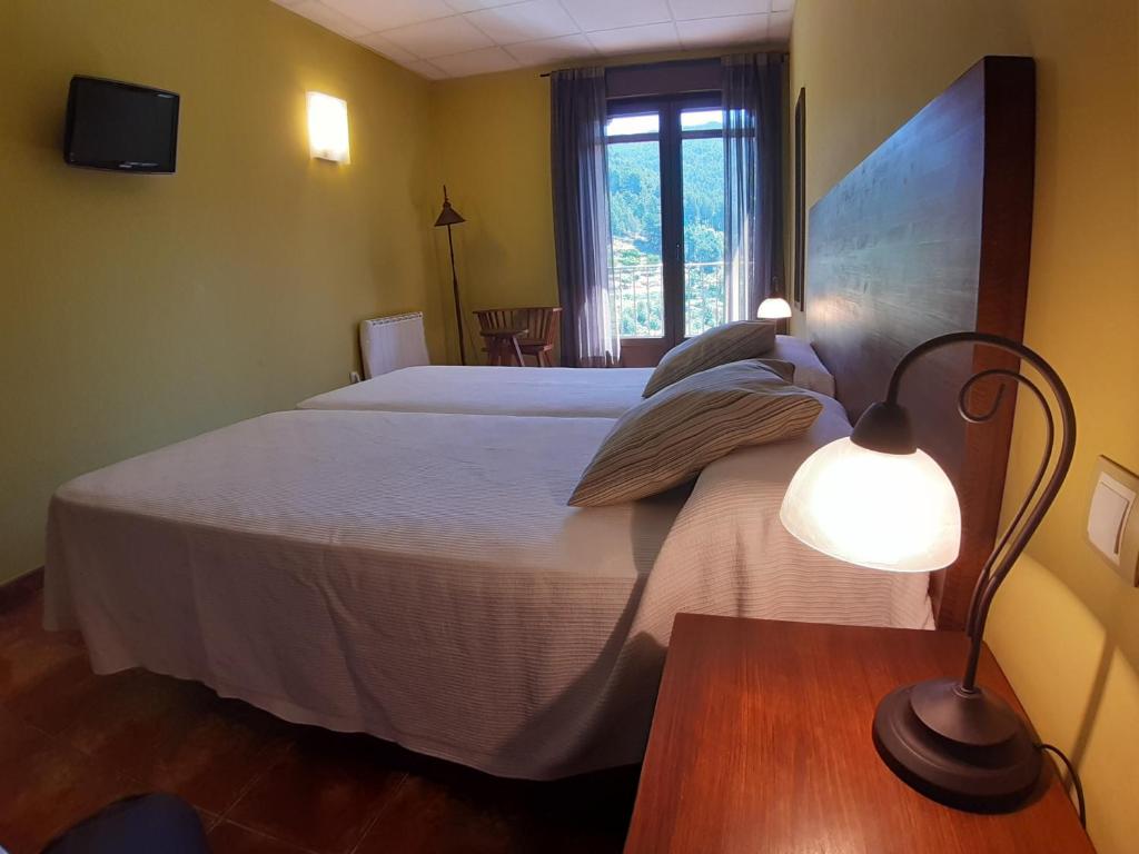 Postel nebo postele na pokoji v ubytování Hotel Rural Los Molinillos