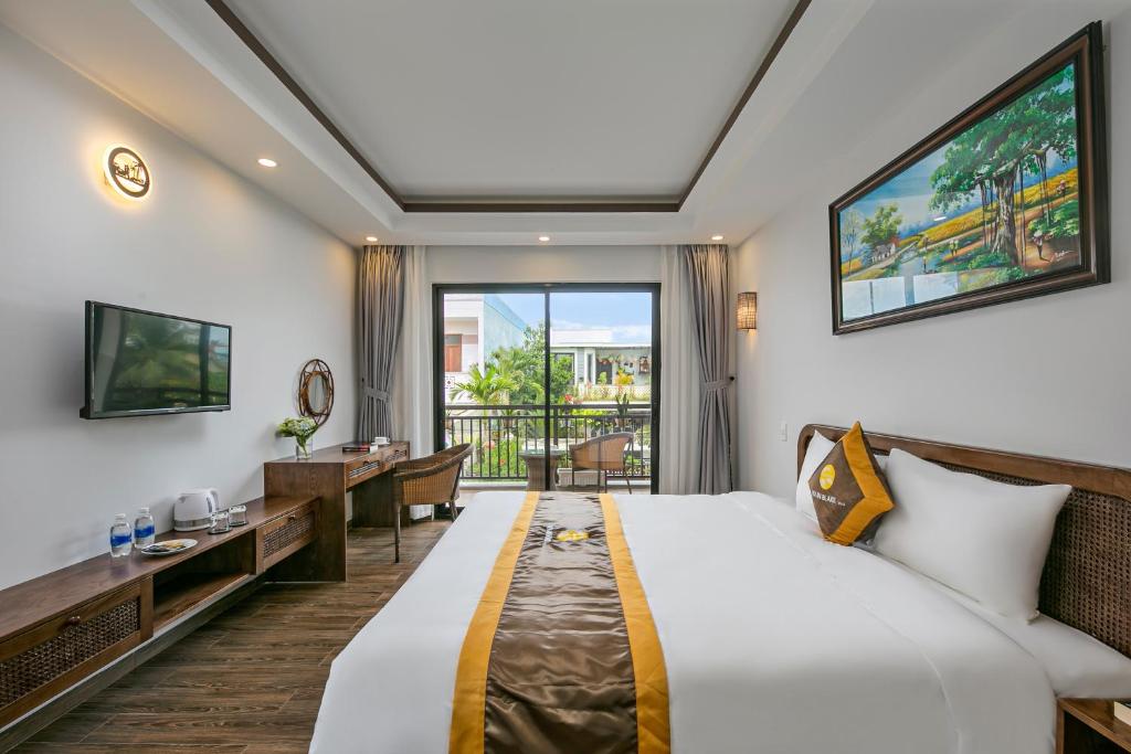 Postel nebo postele na pokoji v ubytování Villa Blake Hoi An