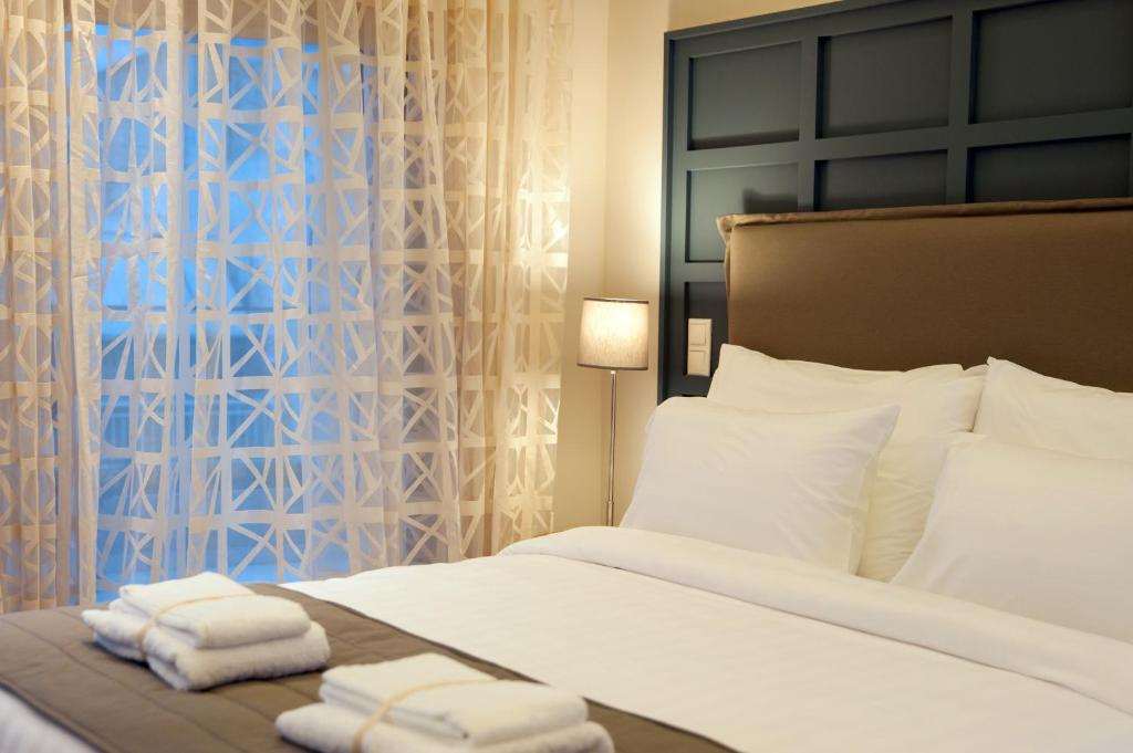 Postel nebo postele na pokoji v ubytování Athens Platinum Rooms and Suites