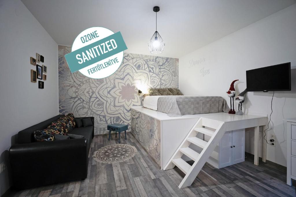 a room with a bed and a desk and a couch at Standard Apartment by Hi5 -Akácfa 57 in Budapest