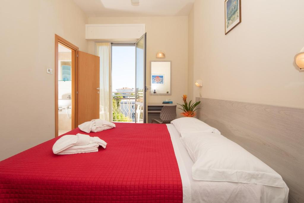 Postel nebo postele na pokoji v ubytování Hotel Lem