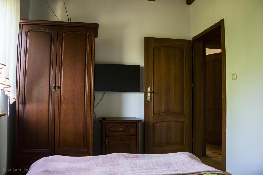 Postel nebo postele na pokoji v ubytování Leśne Zacisze