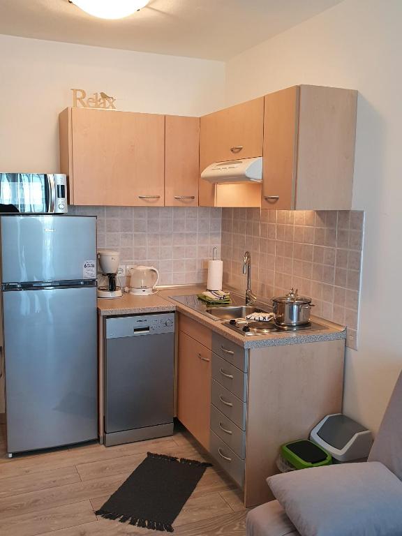 Kuchyň nebo kuchyňský kout v ubytování Apartments RELAX 2