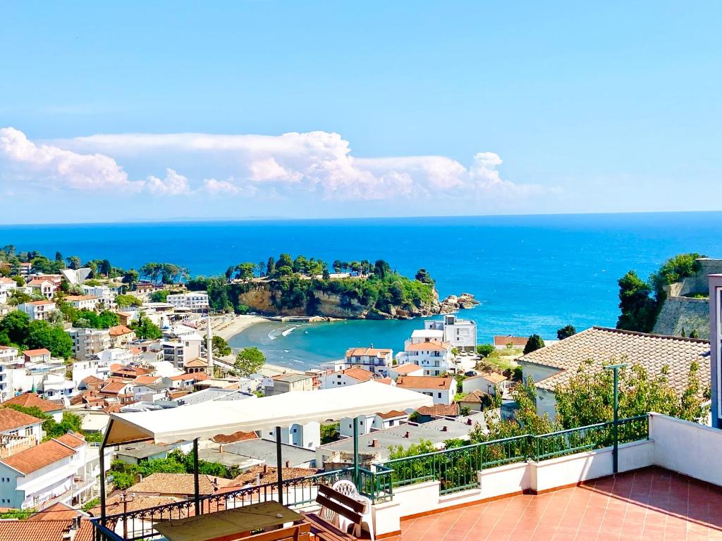 a view of a town and the ocean from a balcony at Apartments Aga in Ulcinj