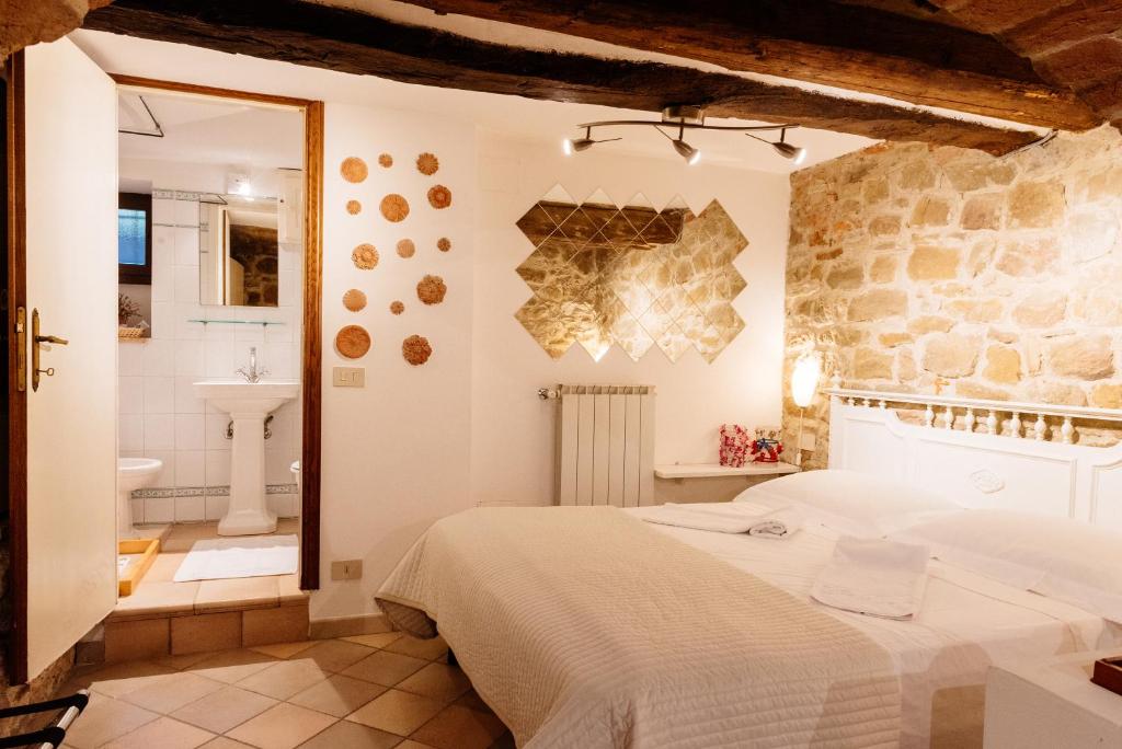 Postel nebo postele na pokoji v ubytování B&B Borgo di Oliveto - Appartamenti con Cucina