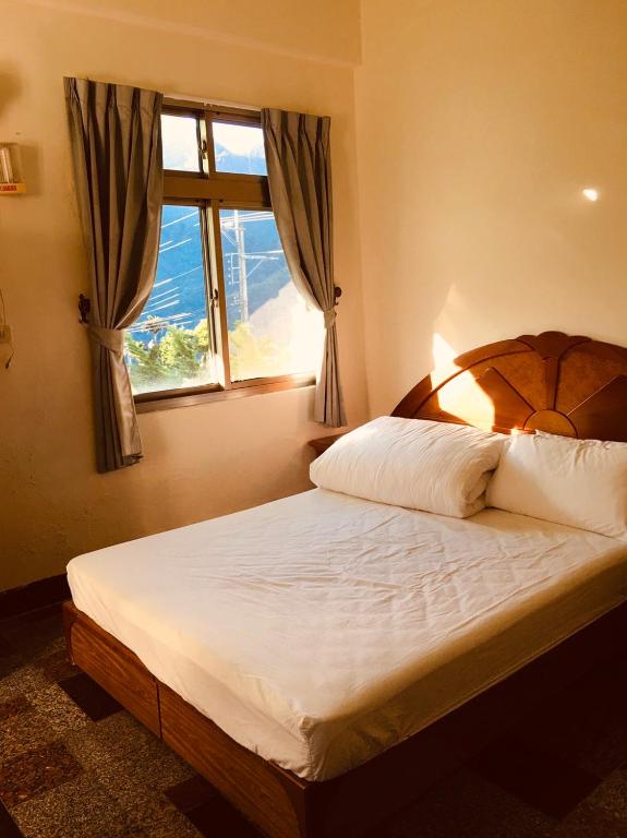 Postel nebo postele na pokoji v ubytování Youlin Homestay