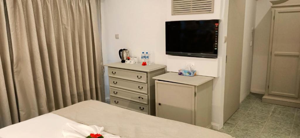 TV a/nebo společenská místnost v ubytování Le Relax Beach Resort