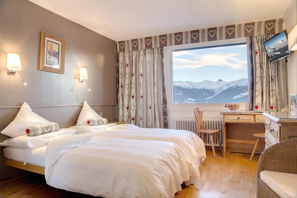 Postel nebo postele na pokoji v ubytování Hotel Ad'Eldorado