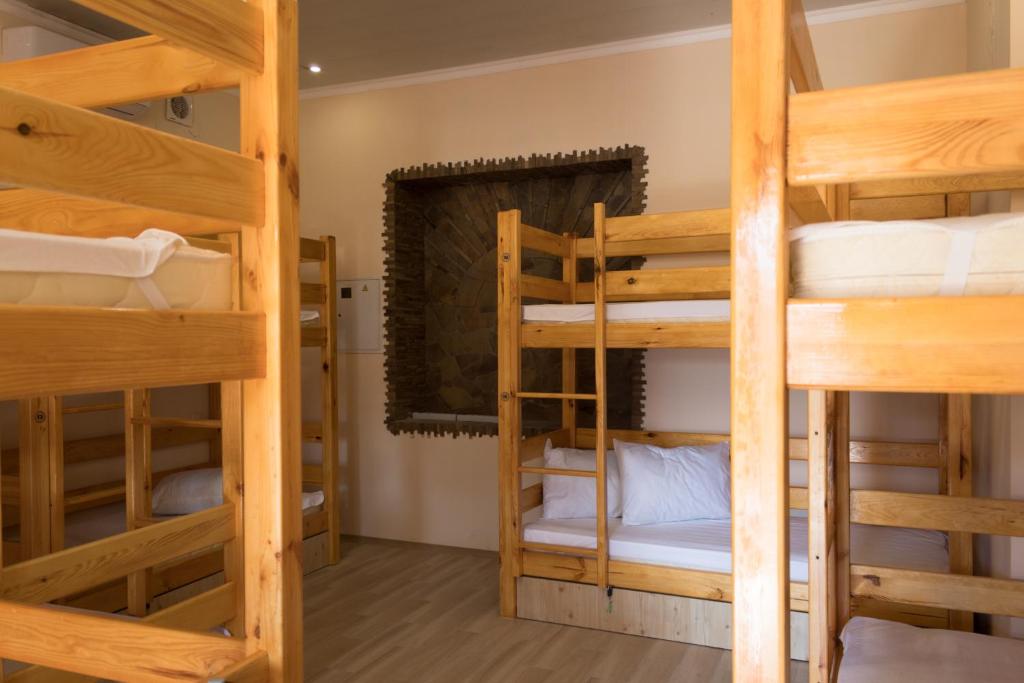 a room with four bunk beds in a hostel at Хостел на Баварии in Kharkiv