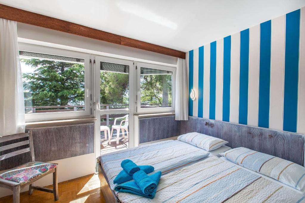 Postel nebo postele na pokoji v ubytování Maestral Residence