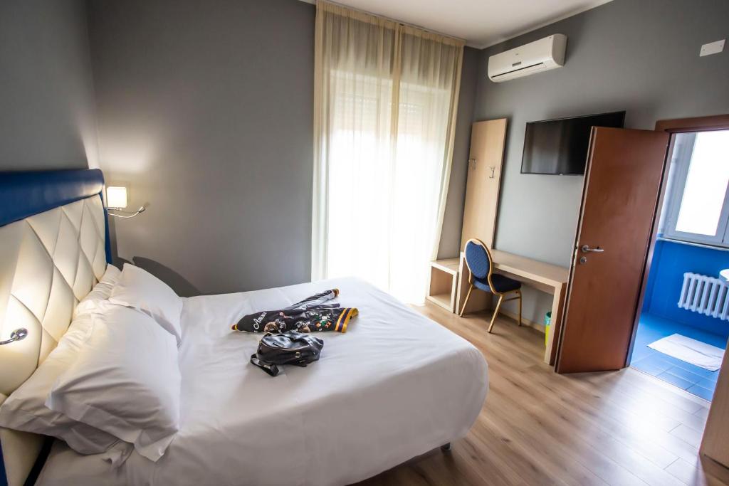 Postel nebo postele na pokoji v ubytování Hotel Gran Sasso & SPA