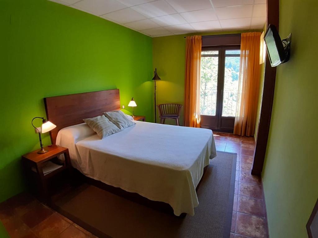 Postel nebo postele na pokoji v ubytování Hotel Rural Los Molinillos