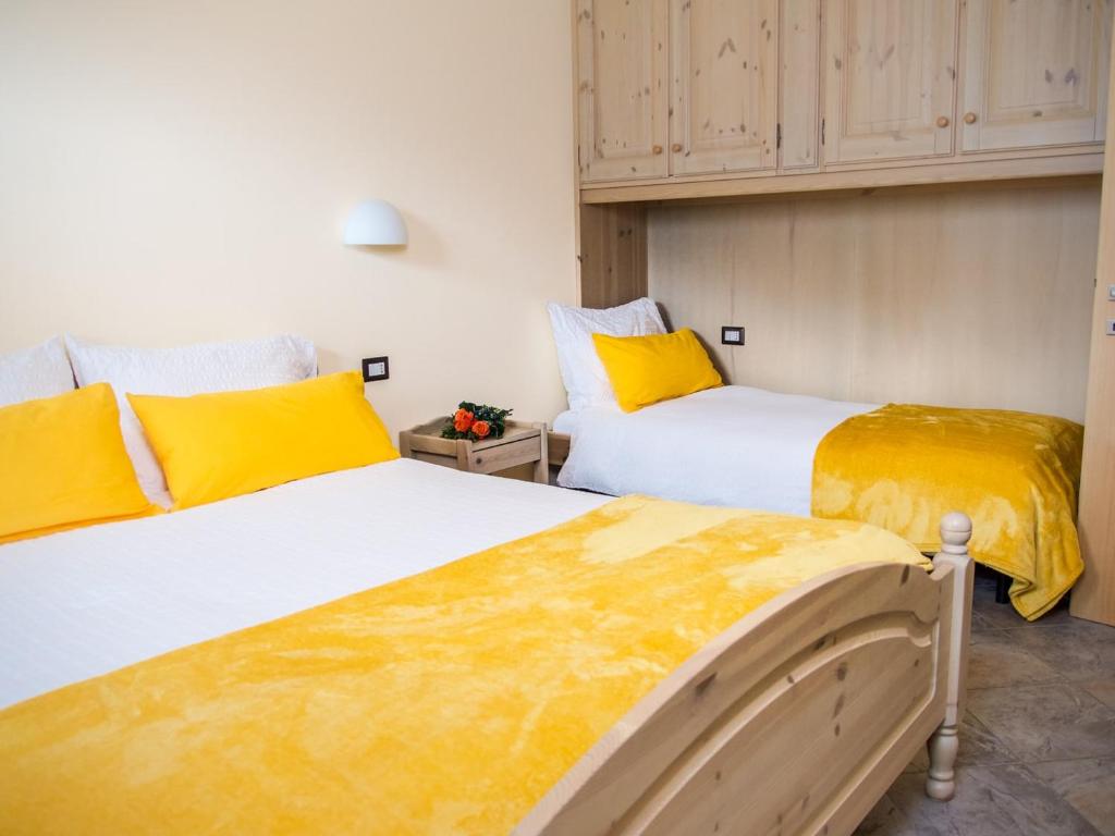 Postel nebo postele na pokoji v ubytování Residence Pedranzini