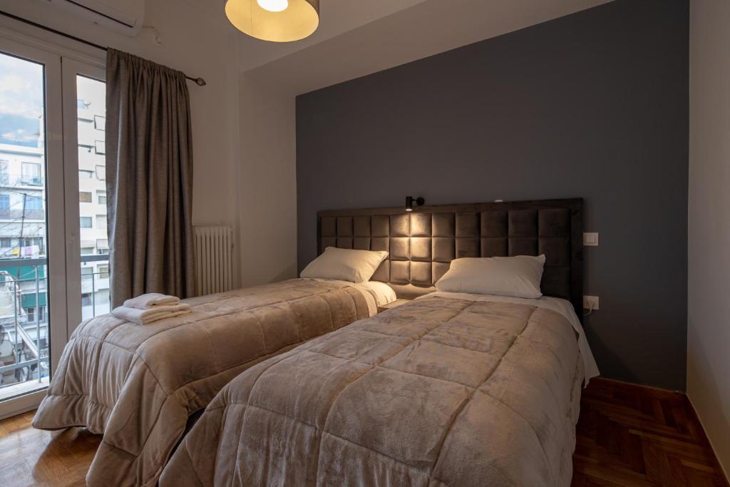 Posteľ alebo postele v izbe v ubytovaní Plato - Acropolis Residence Apartment