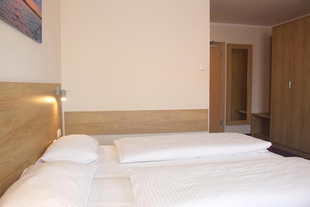 Posteľ alebo postele v izbe v ubytovaní Hotel Huszcza