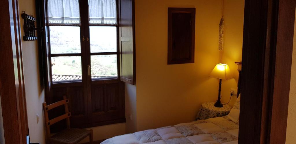 Postel nebo postele na pokoji v ubytování Casa la Capilla