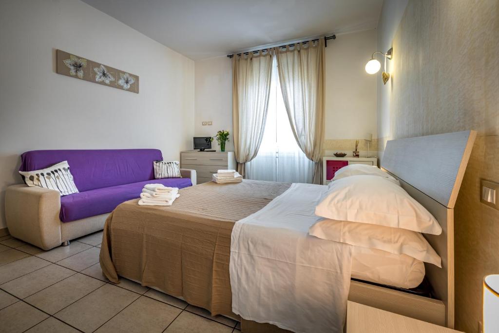 A bed or beds in a room at Affittacamere San Jacopino