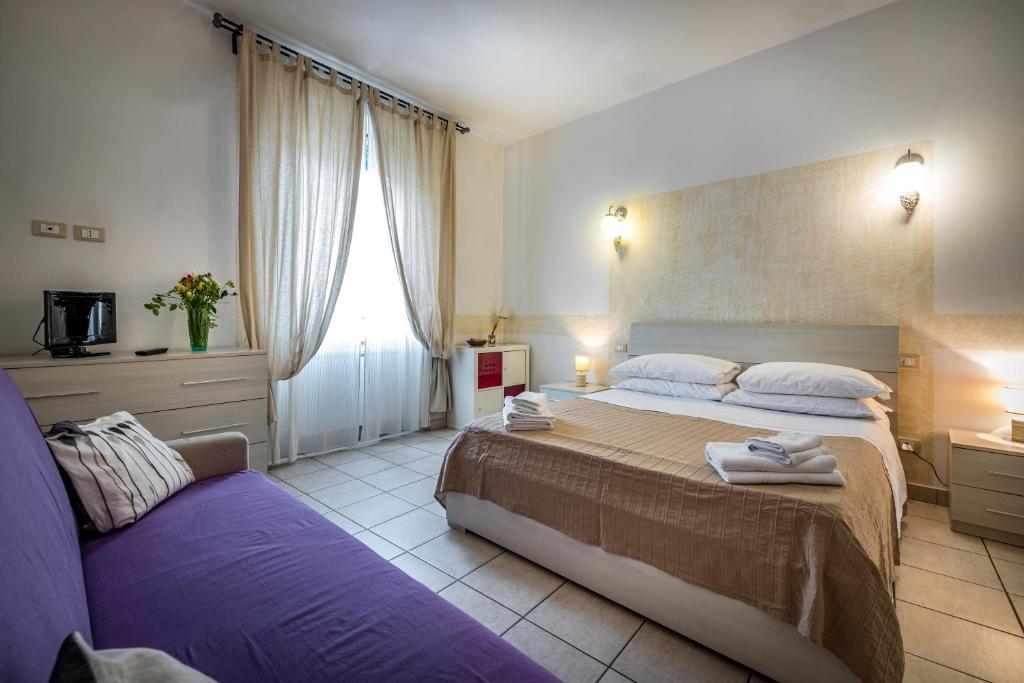 A bed or beds in a room at Affittacamere San Jacopino