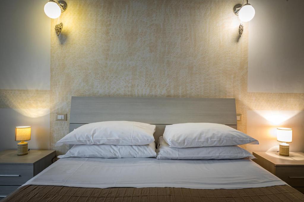 A bed or beds in a room at Affittacamere San Jacopino