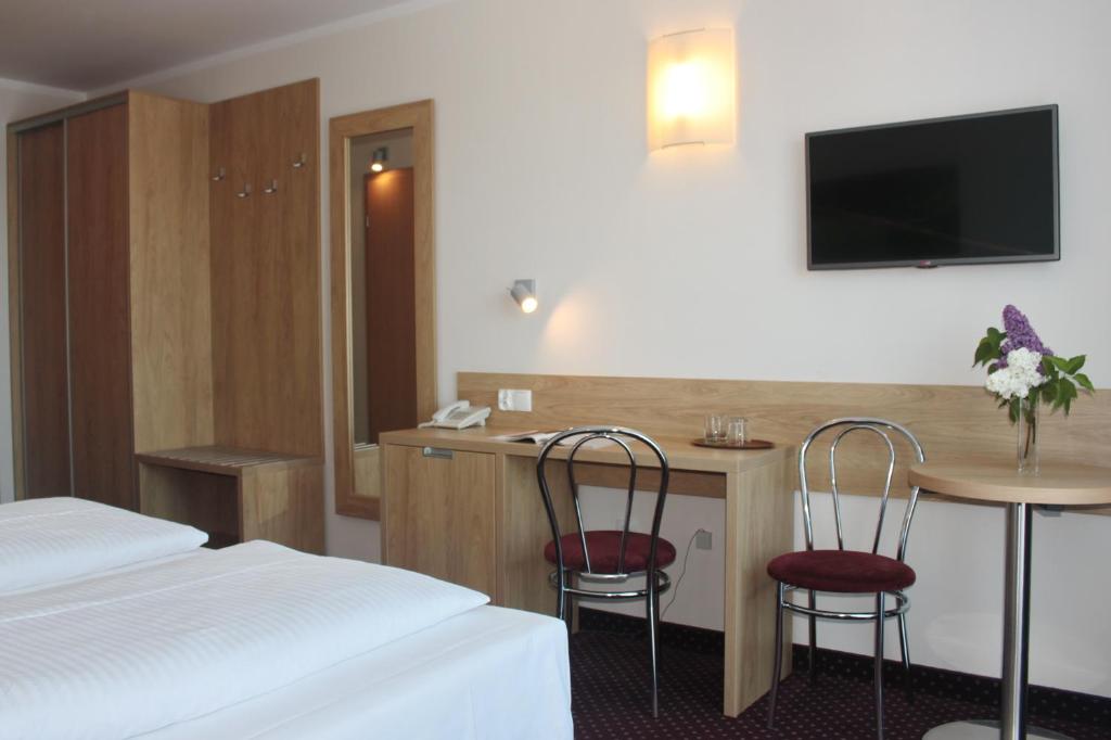 Posteľ alebo postele v izbe v ubytovaní Hotel Huszcza