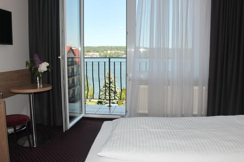 Posteľ alebo postele v izbe v ubytovaní Hotel Huszcza