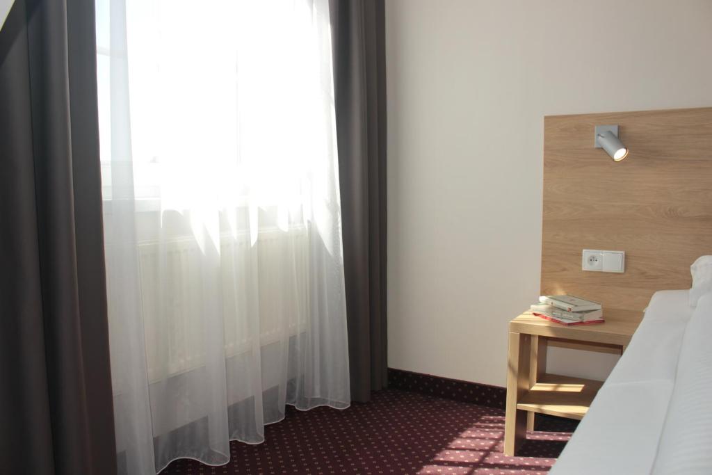 Posteľ alebo postele v izbe v ubytovaní Hotel Huszcza