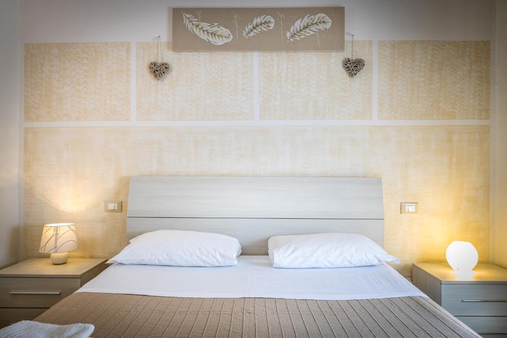 A bed or beds in a room at Affittacamere San Jacopino