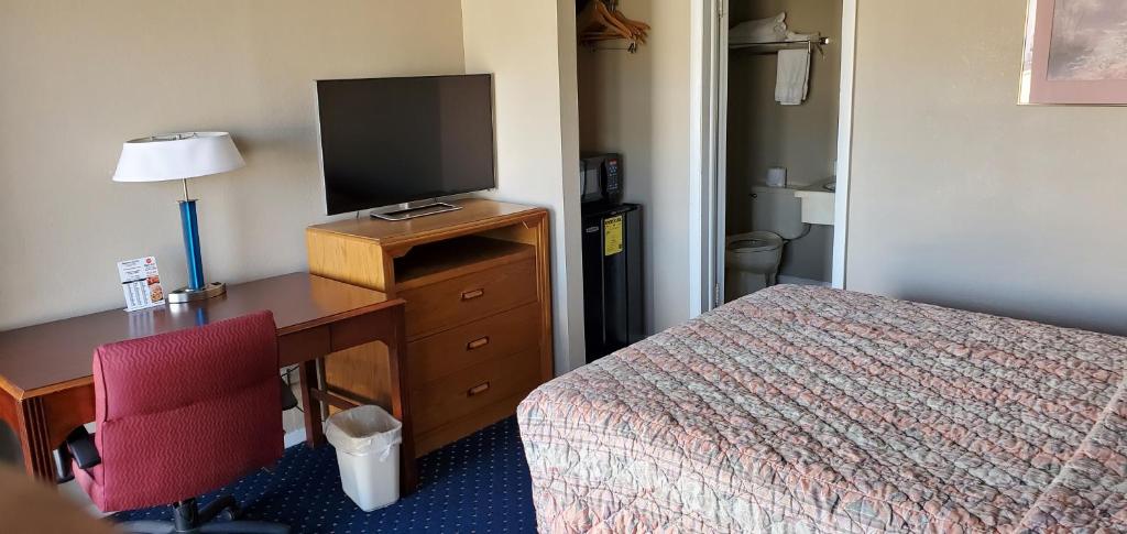 Postel nebo postele na pokoji v ubytování Brooks Motel