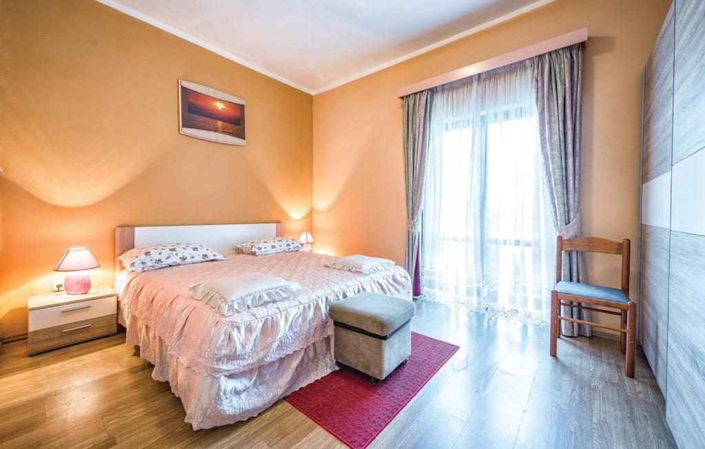 Postel nebo postele na pokoji v ubytování Apartment Tezak