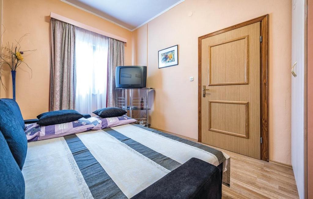 Postel nebo postele na pokoji v ubytování Apartment Tezak