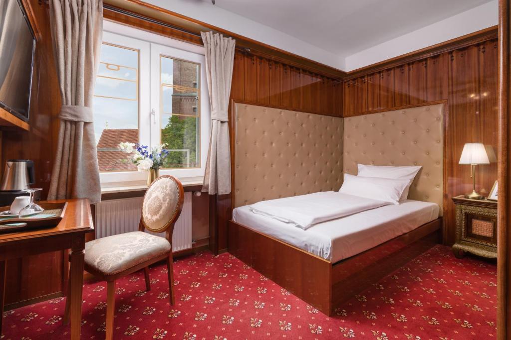 Postel nebo postele na pokoji v ubytování Hôtel du Train
