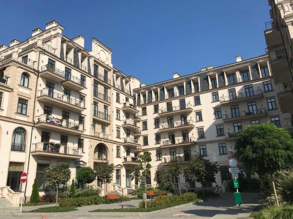 a row of apartment buildings in a city at Apartment Riviera in Fontanka