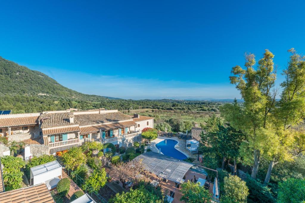 an aerial view of a house with a pool and trees at Can Furios in El Port de la Selva