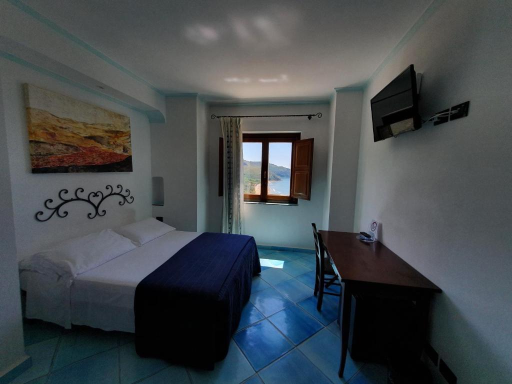 Postel nebo postele na pokoji v ubytování Hotel Corallo Sperlonga