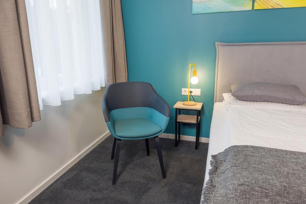 Postel nebo postele na pokoji v ubytování Hotel & Restaurant Mühlenglück