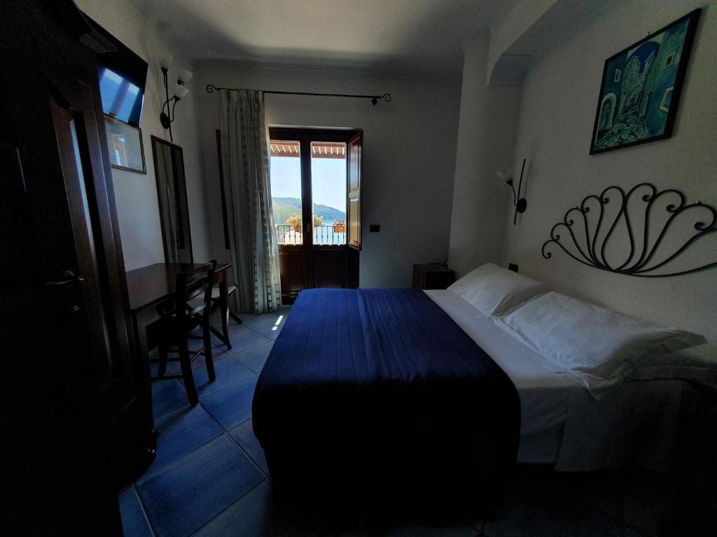 Postel nebo postele na pokoji v ubytování Hotel Corallo Sperlonga