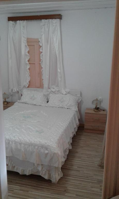 A bed or beds in a room at Villa Angela, Traditional Villa in the village