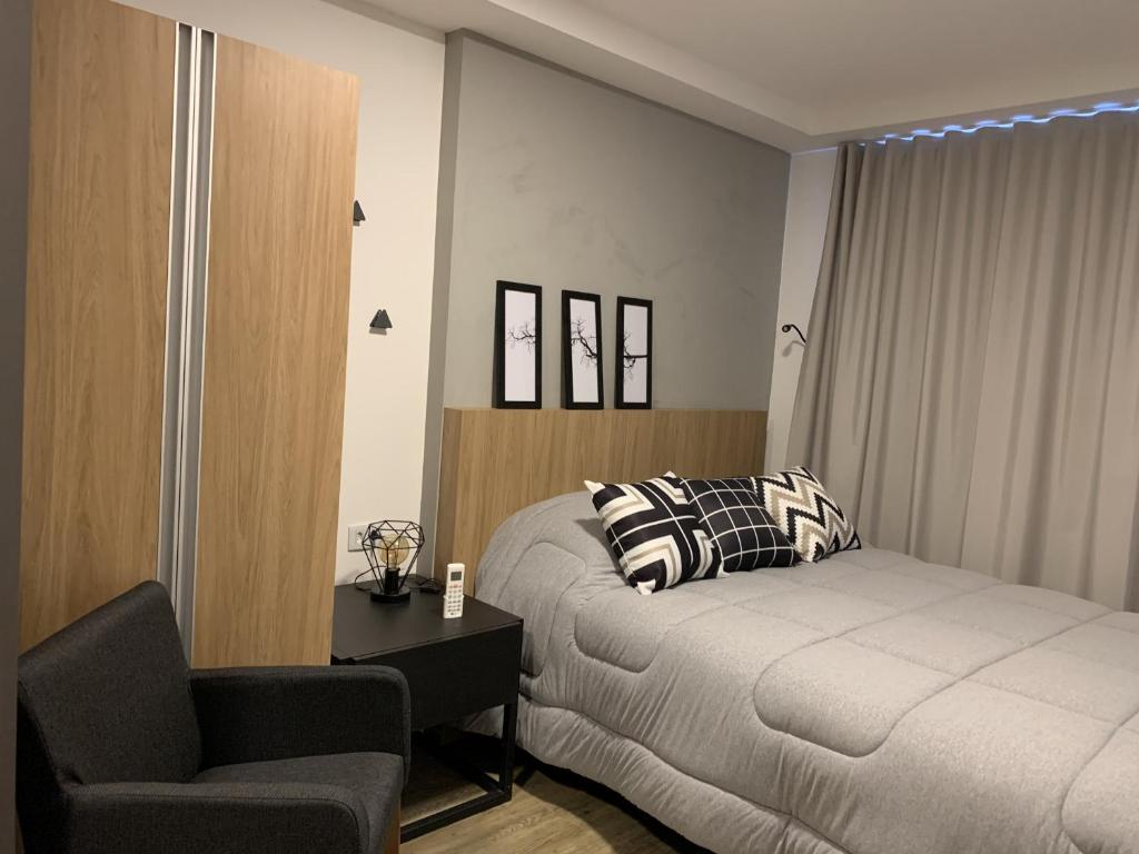 Cama ou camas em um quarto em Luxuoso e Requinte - Studio no Centro - AYN014