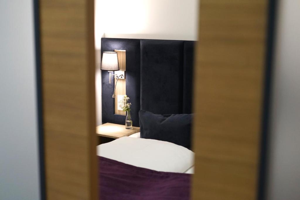 Postel nebo postele na pokoji v ubytování DIWOTEL by Trip Inn Frankfurt Airport Dreieich