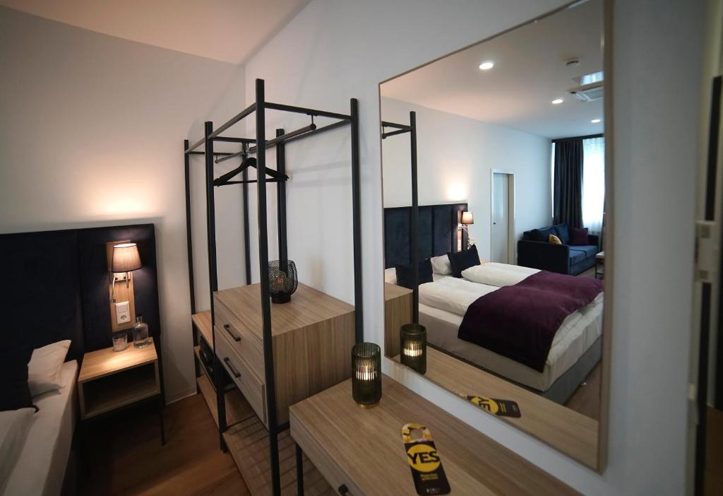 Postel nebo postele na pokoji v ubytování DIWOTEL by Trip Inn Frankfurt Airport Dreieich