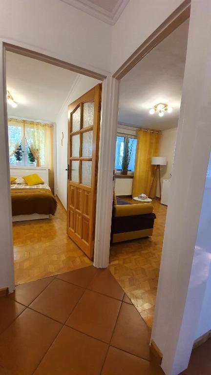 Posteľ alebo postele v izbe v ubytovaní Apartament Motylek