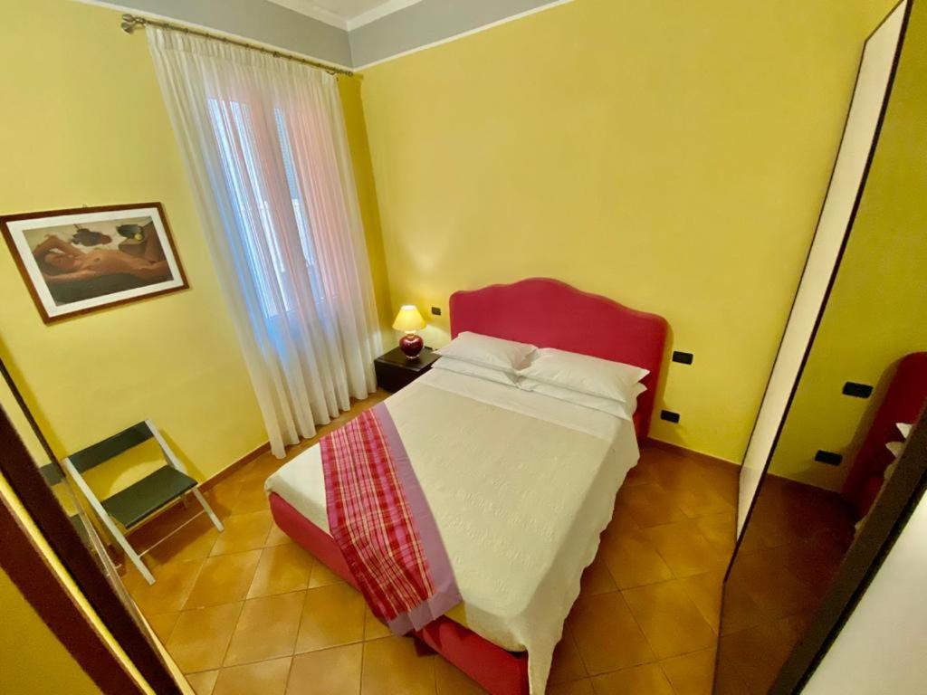 A bed or beds in a room at Nel Sole bilocale