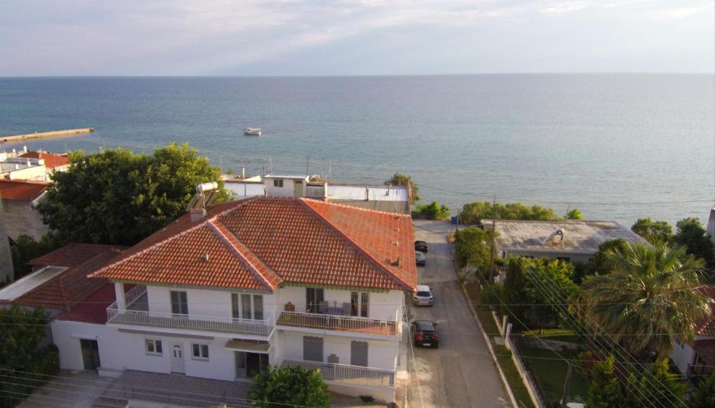 an aerial view of a house and the ocean at Seaside Apartments in Nea Irakleia