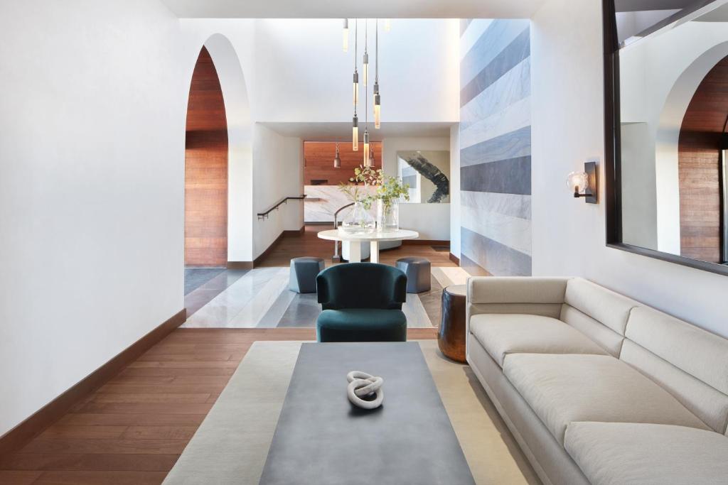 a living room with a couch and a table at Casa Madrona Hotel and Spa in Sausalito