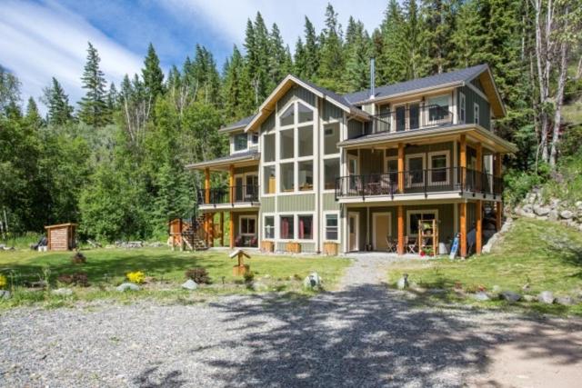 a large house in the middle of a field at Peaks Bed and Breakfast in Sun Peaks