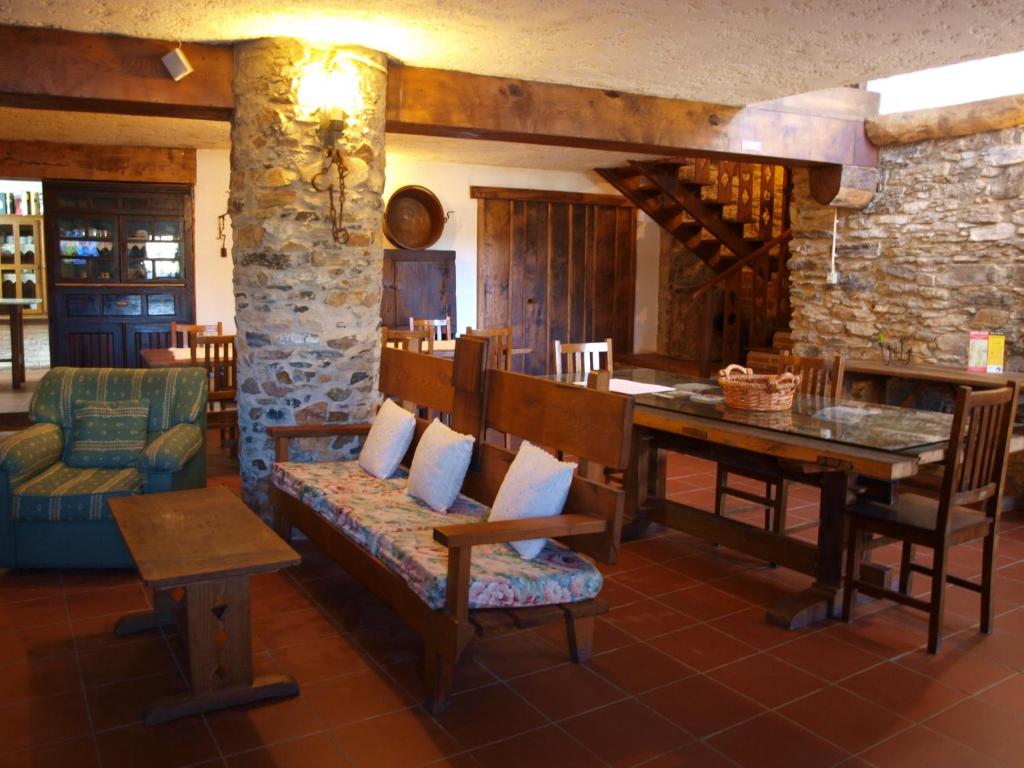 a living room with a couch and a table at Casa da Bica Gondesende in Bragança